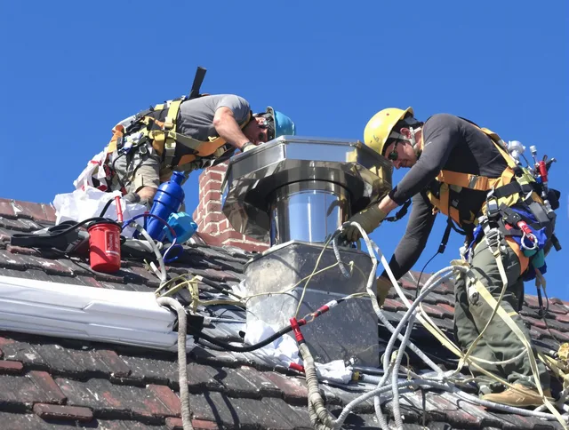 Protective chimney cap installed by Green Chimney Sweep in Green, OH