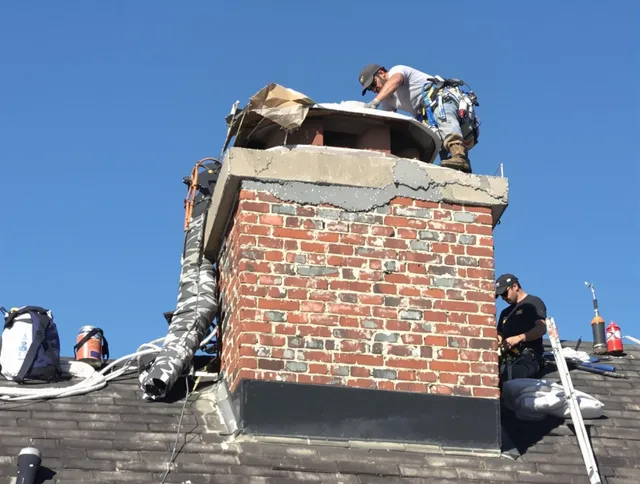 Green Chimney Sweep installing a custom chimney crown in Green, OH