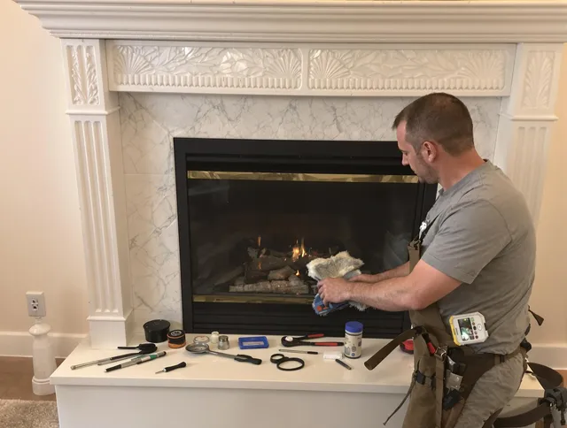 Green Chimney Sweep performing fireplace maintenance in Green, OH