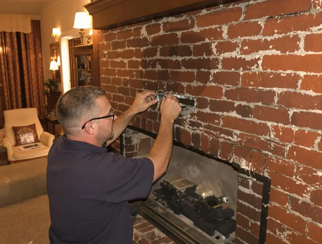 Green Chimney Sweep expert fixing a fireplace in Green, OH